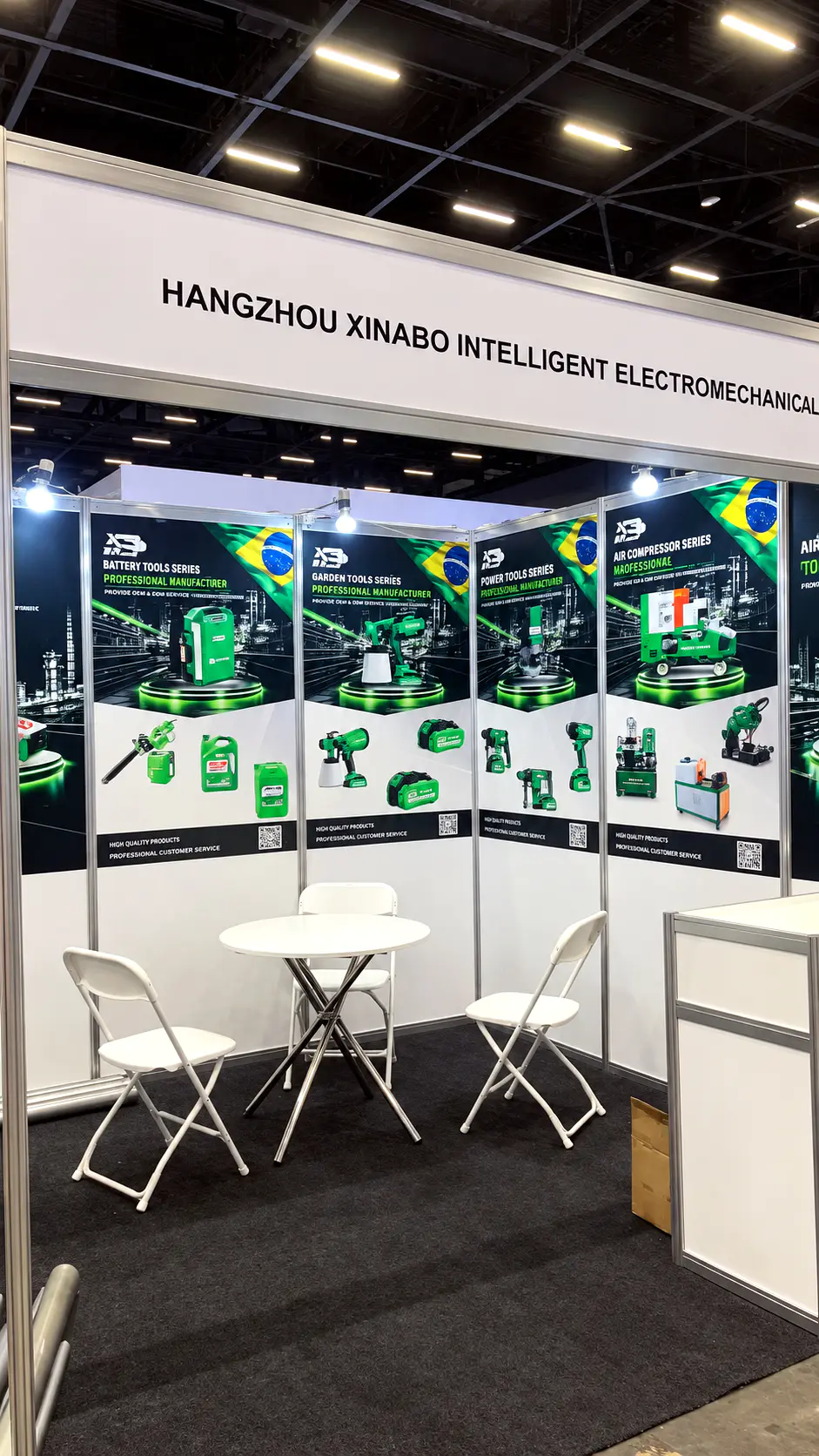 The Hangzhou XINABO booth with product posters for battery tools, power tools and air compressors